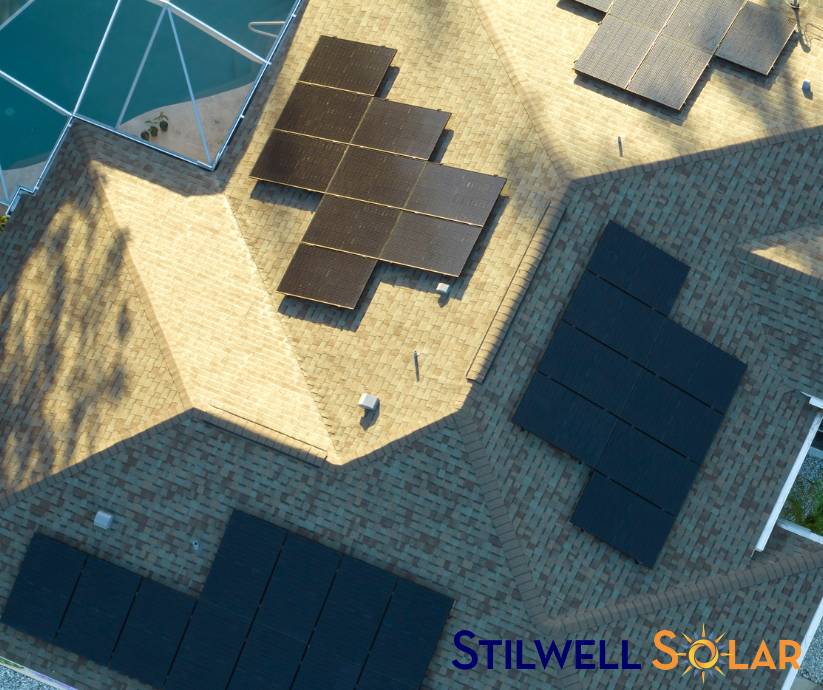 Solar panels on the roof of a home with a pool, providing environmental benefits.