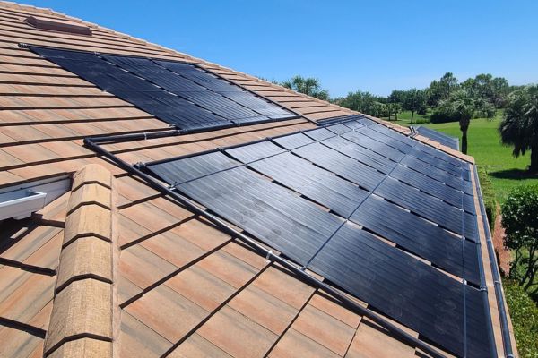 solar pool heating installation on brown roof